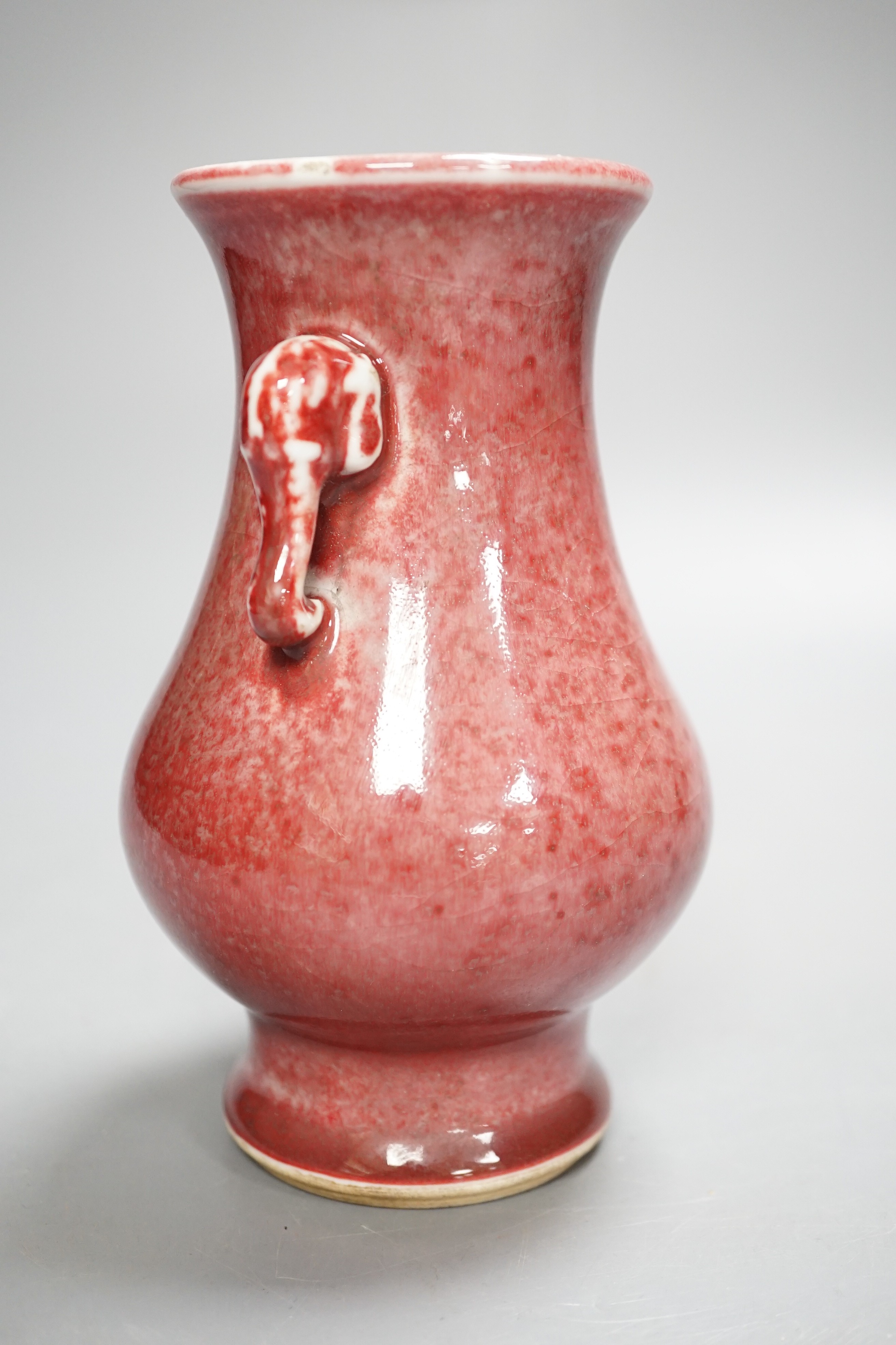 A Chinese Sang de boeuf elephant handled vase 15.5cm